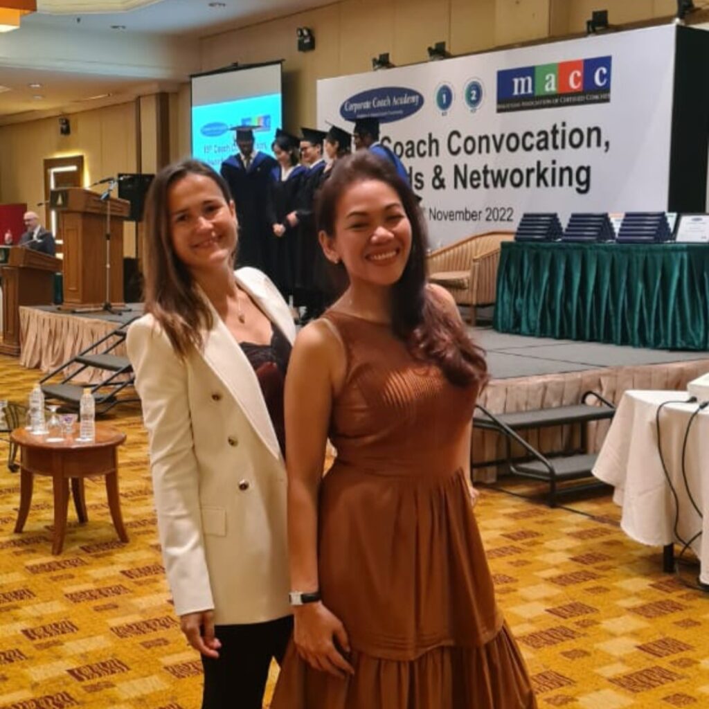 Receiving an award within Corporate Coach Academy Convocation ceremony